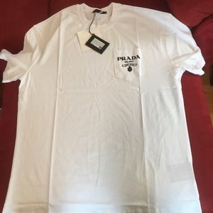 Prada white tee-shirt with print on pocket. Size 2XL. New. Authentic. Never worn
